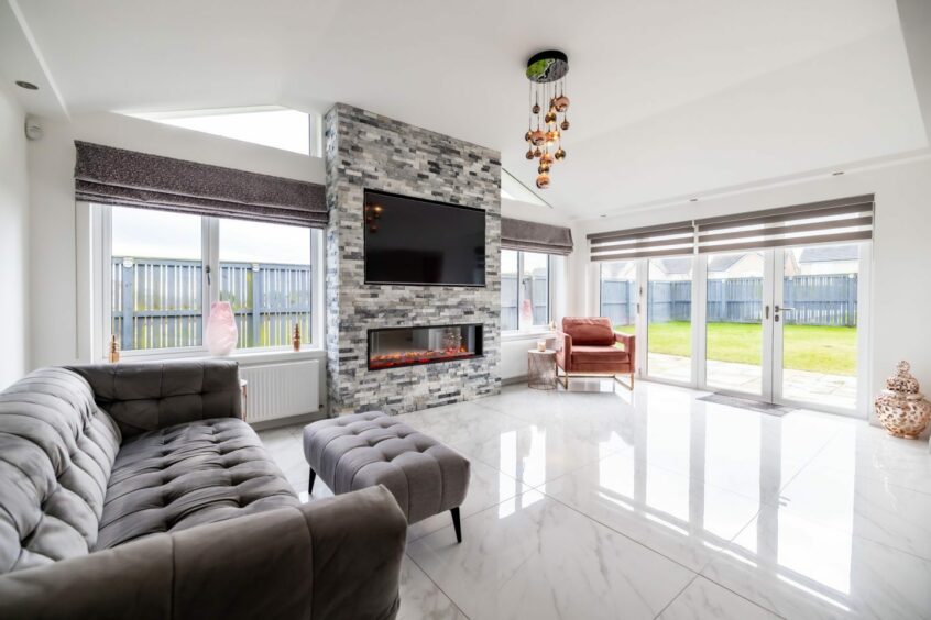 Spacious and modern living room inside the home in Nigg.