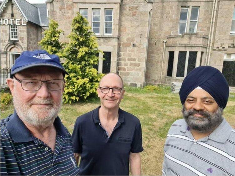 Dave Marshall, Malcolm Laing and Jutinder Singh outside the Huntly Arms Hotel