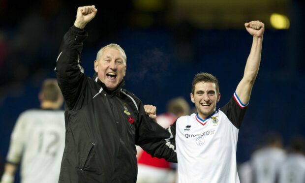 Terry Butcher and Graeme Shinnie celebrate a 3-0 League Cup victory against Rangers at Ibrox in 2012. Image: SNS