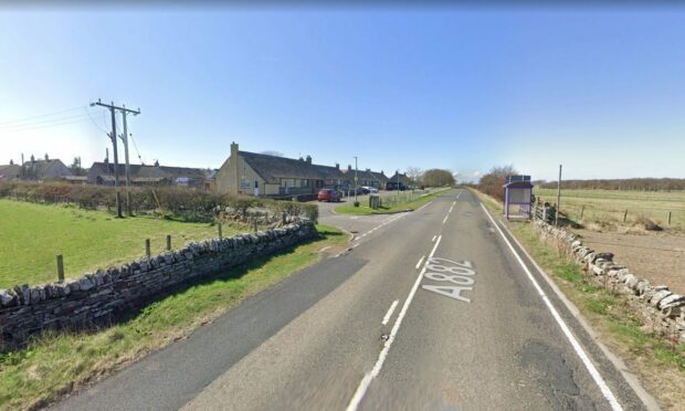 A rod of Idyllic houses line the A882 road on the left at Haster.