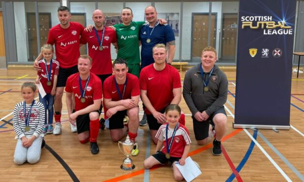 The Aberdeen Futsal Academy team pictured with the Scottish Cup trophy. Back row (left to right): Michael Watt, Alan Redford, Dmytro Zabrodin, David Littlejohn (manager). Front Row (left to right): David Booth, Grant Campbell, Chris Angus, Dean Elrick (coach). Photo courtesy of Grant Campbell.
