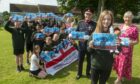 Armed Forces Day flag designer Lilly Russel Lord-Lieutenant of Aberdeen David Cameron, the Lady Provost of Aberdeen Hazel Cameron, Lilly's classmates and her teacher.