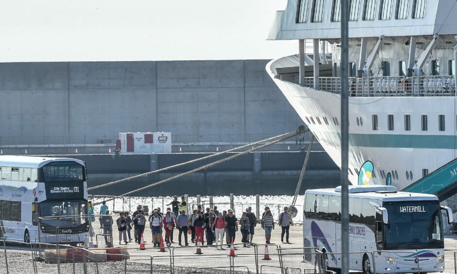 Tourists packed onto buses at Aberdeen south harbour headed for the city centre and spots around the north-east. Image: Darrell Benns/DC Thomson