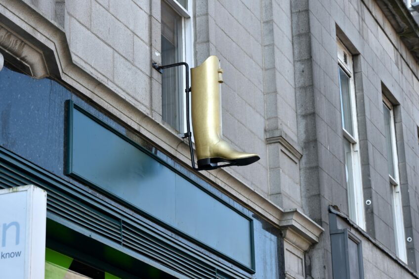 The golden boot above the Gidi Grill on Union Street