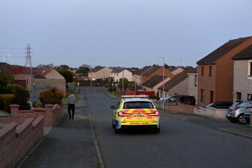 A police can can be seen sitting on Inverugie Road in Peterhead. 