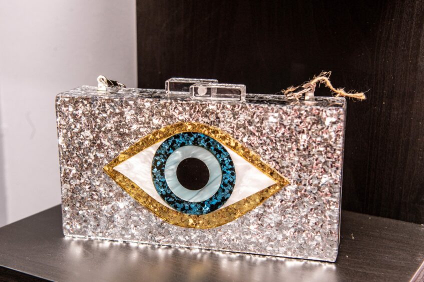 Bedazzled clutch with eye motif at House of Jane.