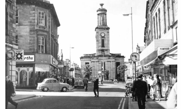 Looking down Elgin High Street in black and white photo.