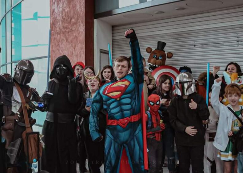 Group of comic fans dressed at a BGCP Comic Con.