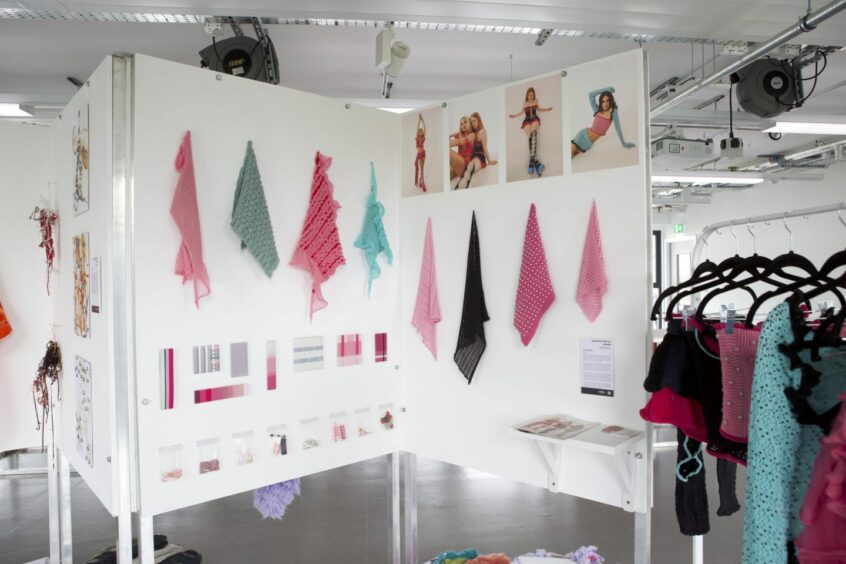 Textiles hanging on a display board at the Gray's Degree Show 