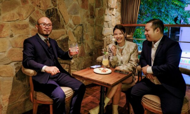 Guests try out the restaurant at the new whisky "experience" in Vietnam