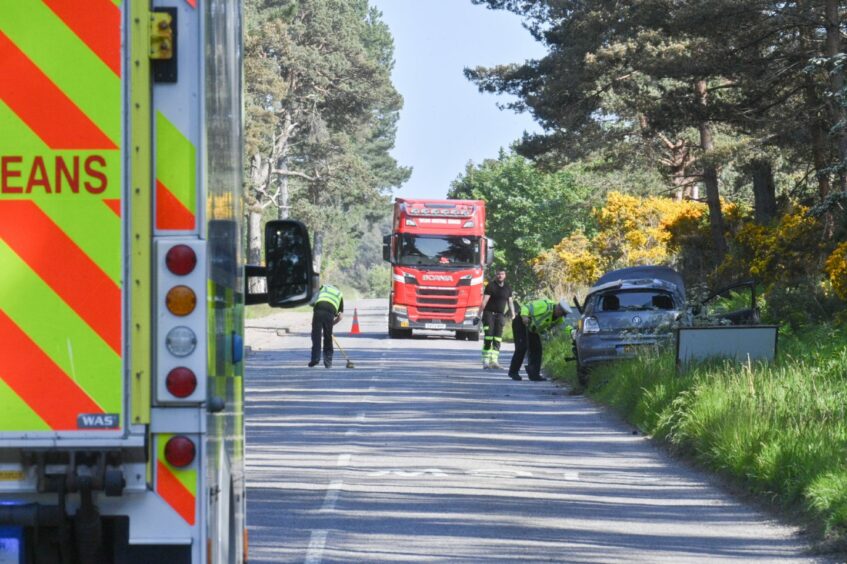 Police are see working at the scene of a two-vehicle crash in Lossiemouth.