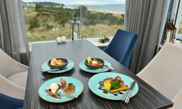 Four plates at a window table at the Sun Dancer in Nairn looking over the coast.