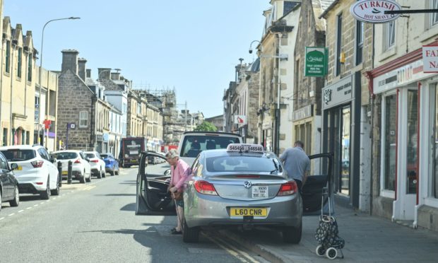 Elgin Community Council wants £20m announced by the UK Government for the town to be used to tackle illegal parking. Image: Jason Hedges/DC Thomson