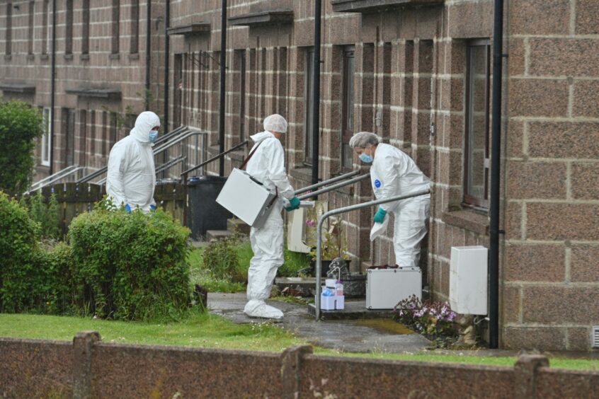 Forensic officers arrive on the scene in Peterhead. 