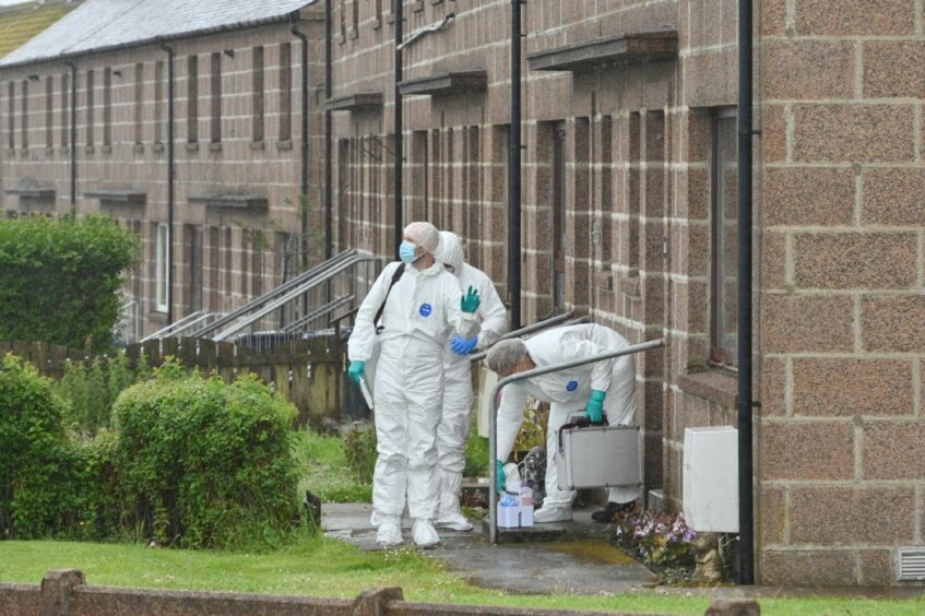 Forensic officers were working inside the Peterhead home. 