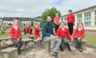 Javi Cabrera Valdes and some of his pupils outdoors at Dalneigh Primary School in Inverness.