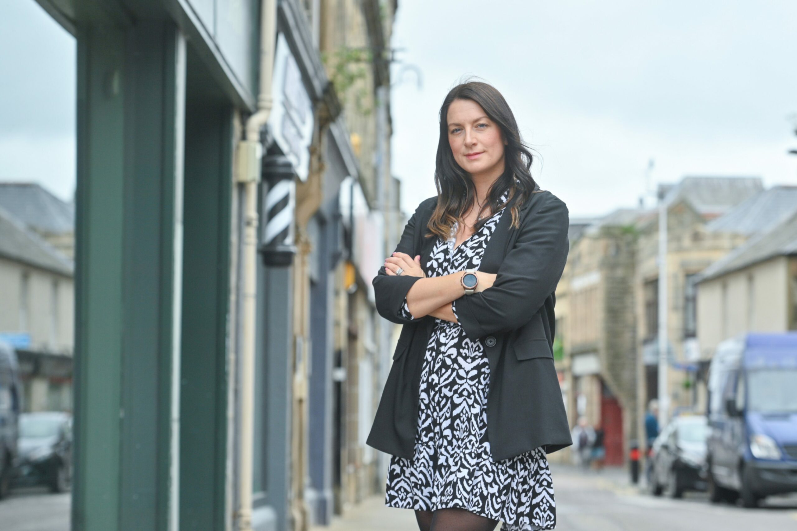 Moray Chamber of Commerce chief executive Sarah Medcraf with arms folded in Elgin town centre street. 