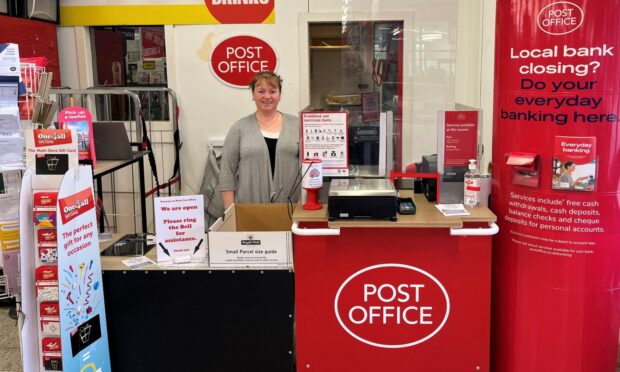 Joy Dunlop taking charge of the new Wick Post Office. Image: Supplied by Post Office.