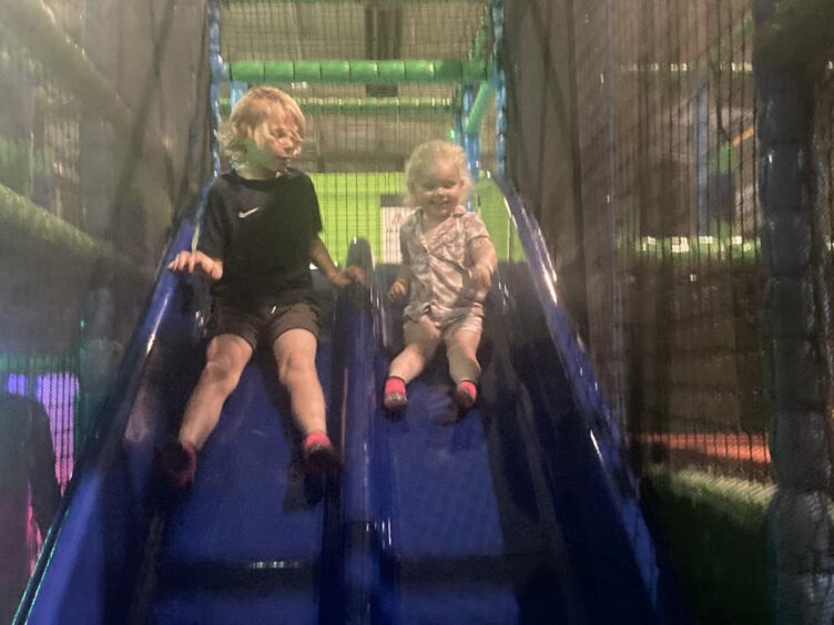 Children on the slides at Jump In.