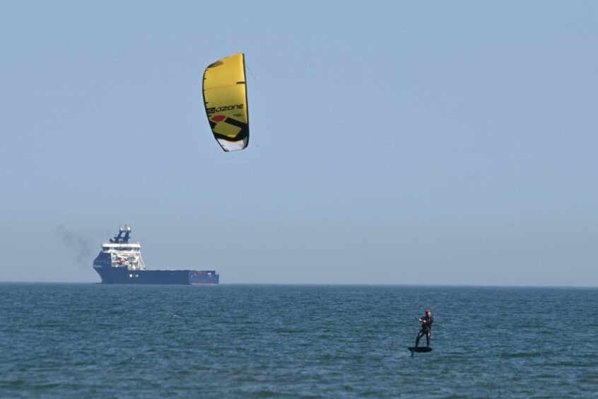 Man kitesurfing at Aberdeen Beach.