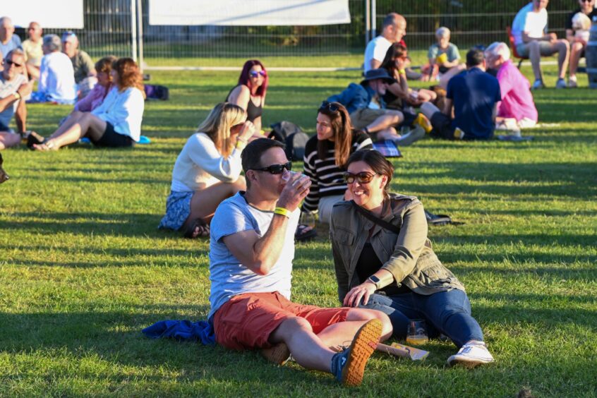 Revellers enjoying beers in the sun at Baird Park. 