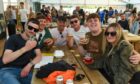 Five young people pose with their drinks at the Midsummer Beer Happening.