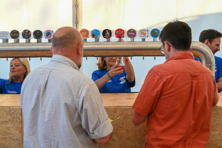 Festival goers choosing which beer to try.