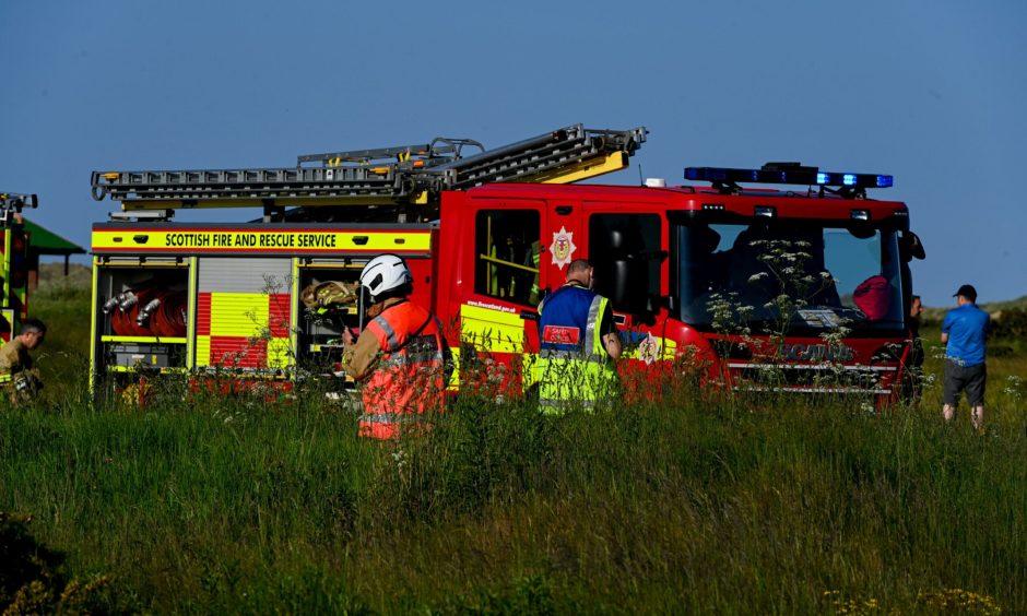 Fire engine and firefighters.