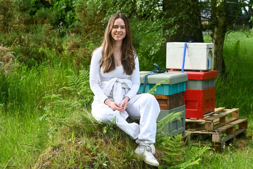 Kaya with her artificial bee hives.