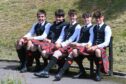 Pipe Band members took a break in the sun. Image: Kenny Elrick/DC Thomson