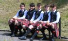 Pipe Band members took a break in the sun. Image: Kenny Elrick/DC Thomson