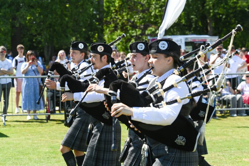Four pipers in Duthie Park