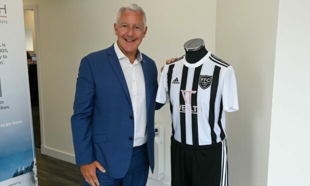 New Fraserburgh vice-chairman George Thom pictured with the club's new home kit. Pictures by Kenny Elrick