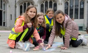Pupils from Walker Road, Ferryhill and Orchard Brae schools at the Chalk Don't Chalk event at Marischal College with artist KMG. Image: Kath Flannery/ DC Thomson.