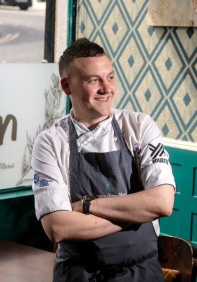 Graham Mitchell wearing his chef uniform