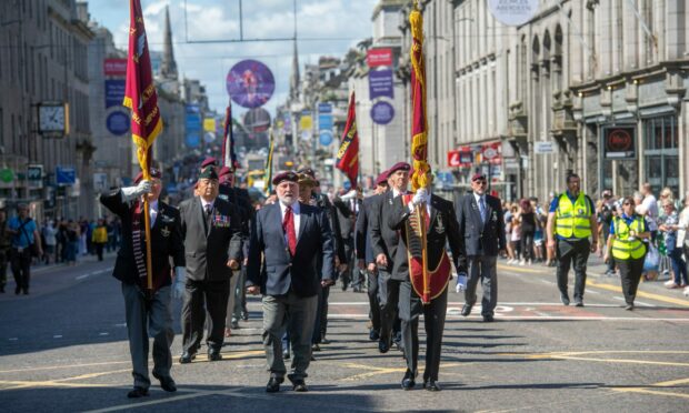 Veterans take part in the Armed Forces Day parade on Union Street