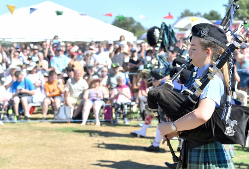 Ballater Highland Games at Monaltrie Park, Ballater. The massed pipe bands. 