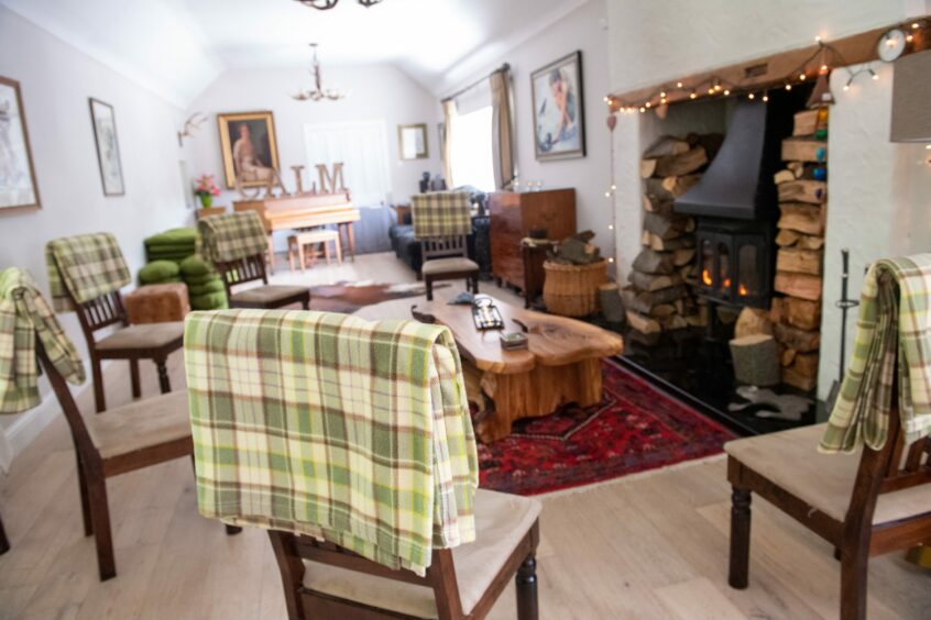 The interior of Toadhall Rooms in Stonehaven with a cosy fireplace, a peaceful retreat for those visiting. 