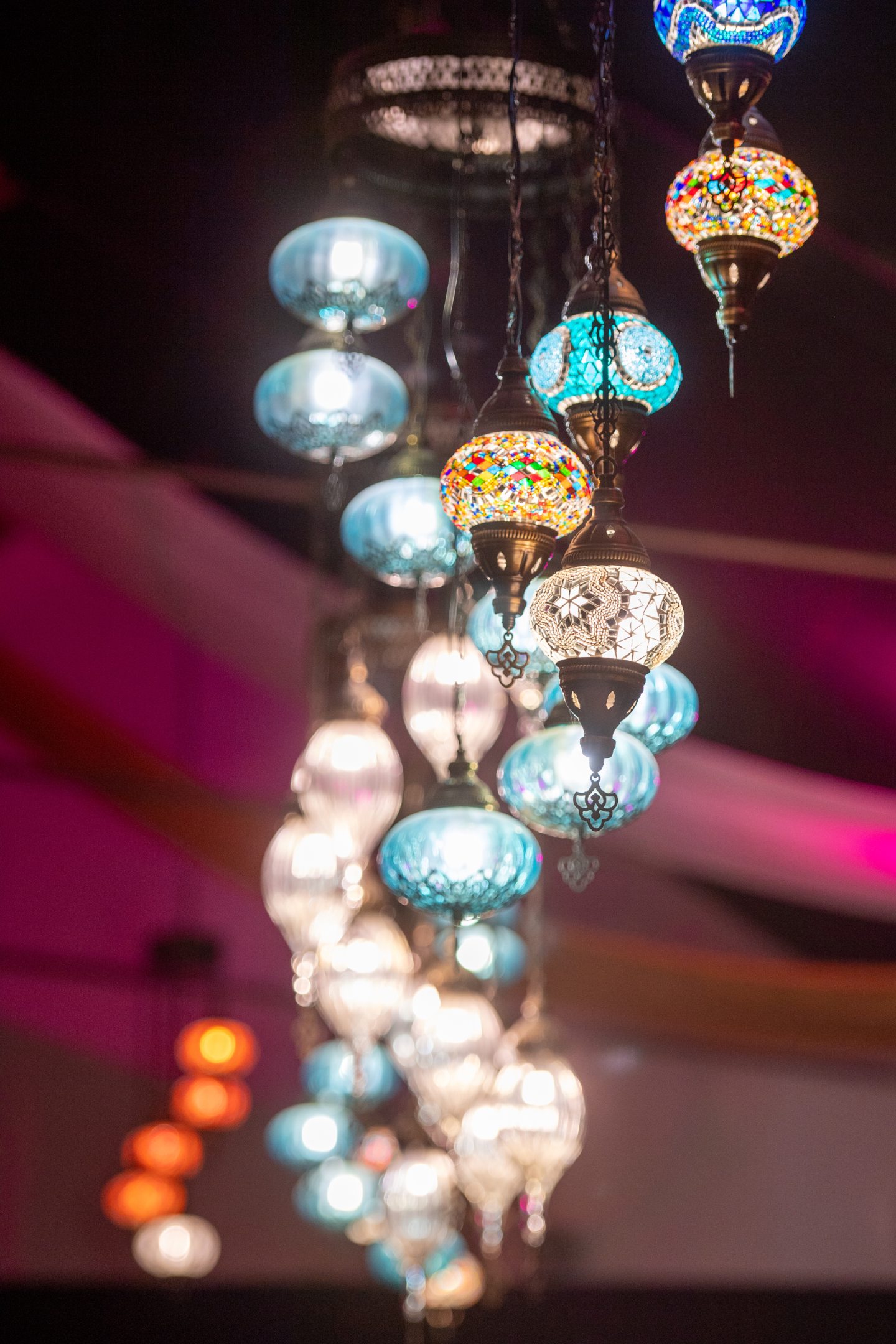 Colourful Turkish chandeliers inside restaurant.