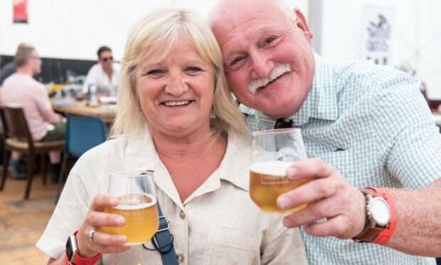 Ian and Suzanne McCann enjoying a pint in the Stonehaven Marquee.