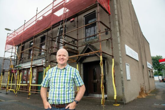 Stuart Watt, pastor of Mintlaw Community Church, outside the former Garret bar which is being transformed into a place of worship. Image: Kami Thomson/DC Thomson