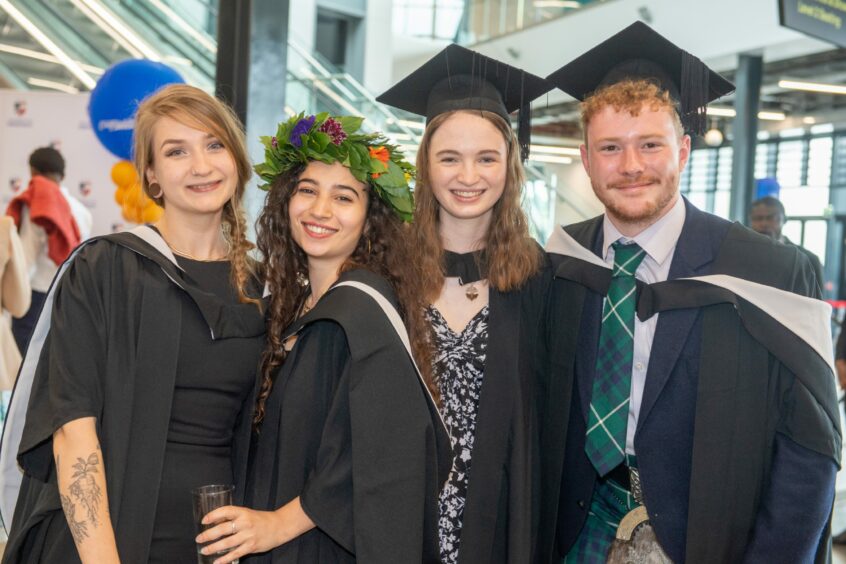 Aberdeen University students pose for pictures at the graduation ceremony.