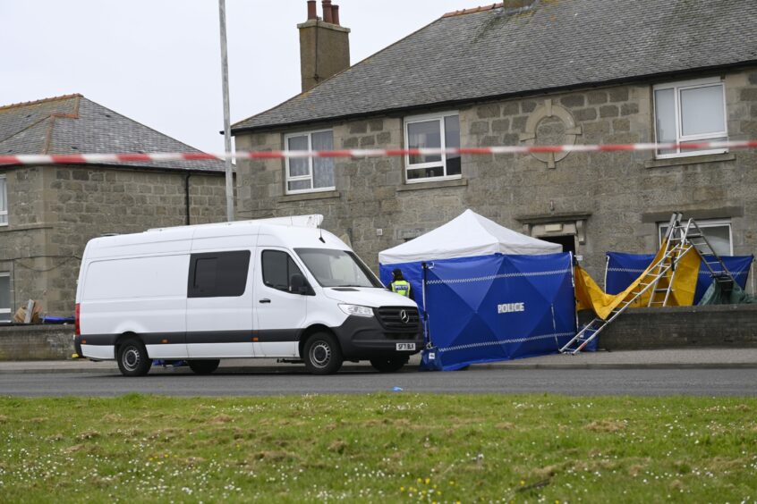 Blue police tents and a forensics van around a home on Watermill Street, Fraserburgh. 