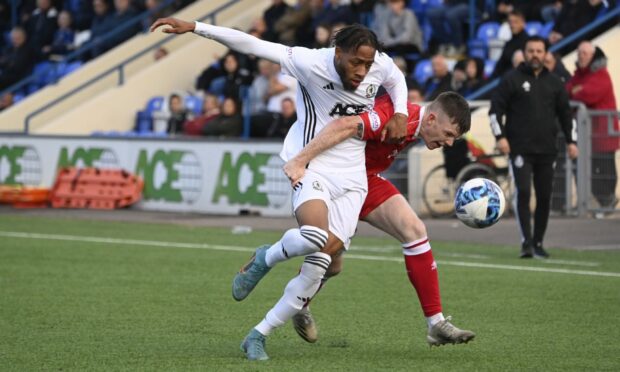 Cove Rangers summer-signing Rumarn Burrell battles for the ball in a friendly against Dunfermline.