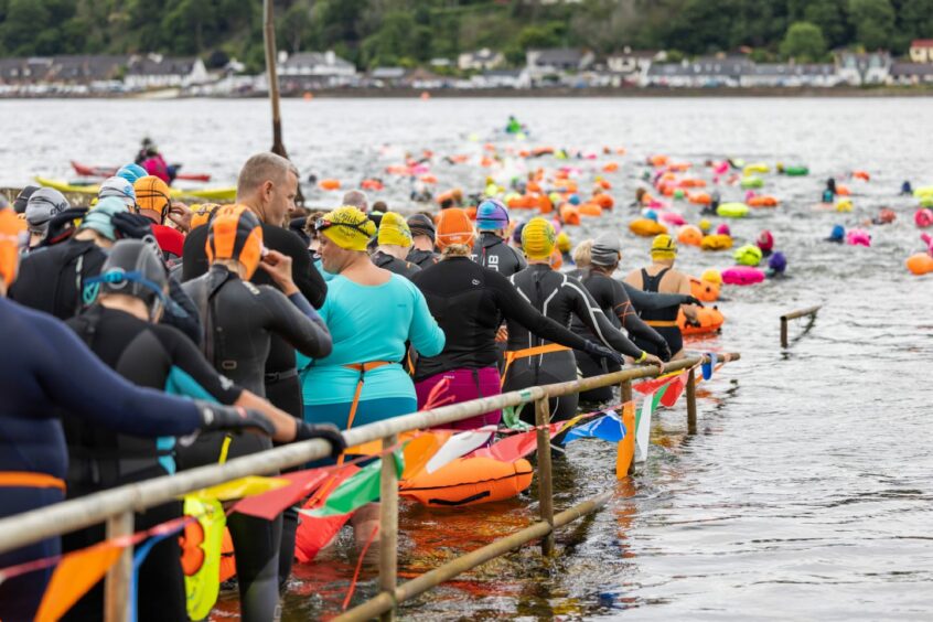 Participants waiting to take the plunge into the Moray Firth.