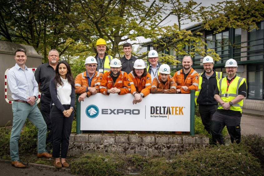 DeltaTek founder Tristam Horn, left, with some of the DeltaTek and Expro team in Aberdeen. 