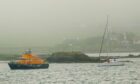 Lerwick lifeboat towing the Norwegian yacht