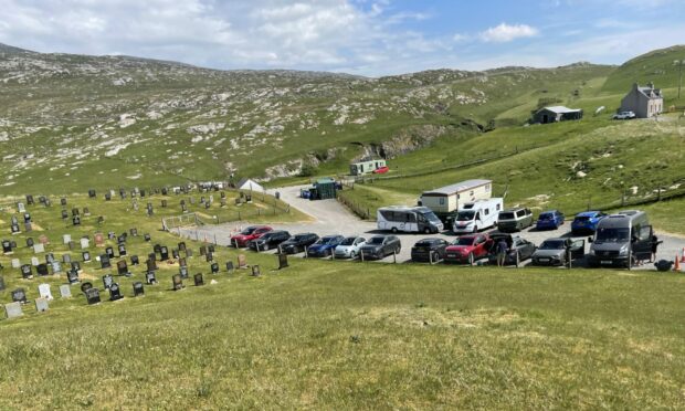 Cars and camper vans visiting Luskentyre Beach are taking up parking spaces for patrons to Luskentyre Cemetery.