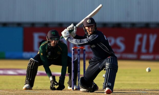 Michael Leask, right, sweeps a ball to the boundary in Scotland's win against Ireland