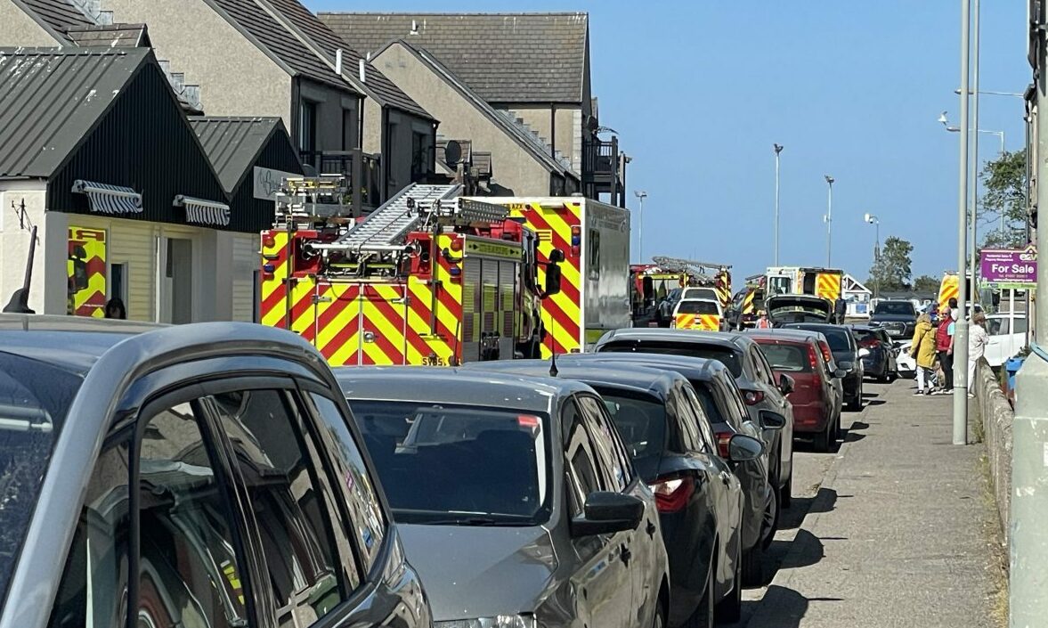 Line-up of fire engines and ambulance on neighbouring street to Harbour Street. 